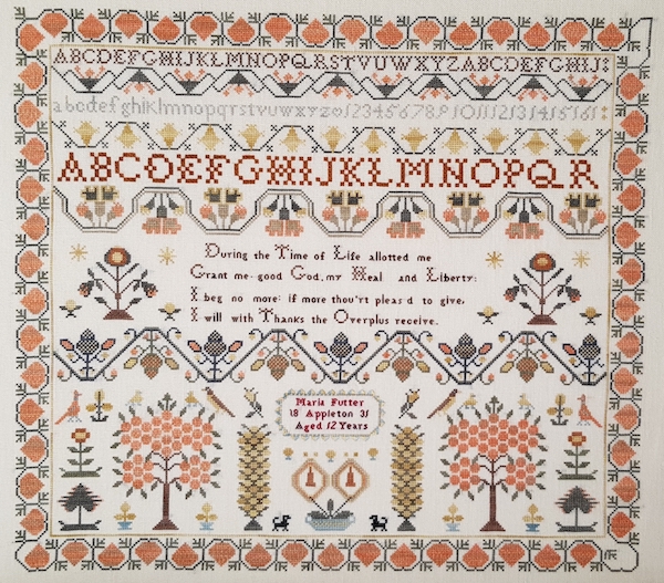 sampler reproduction of maria futter appleton from 1831 in fall colors with alphabet and trees