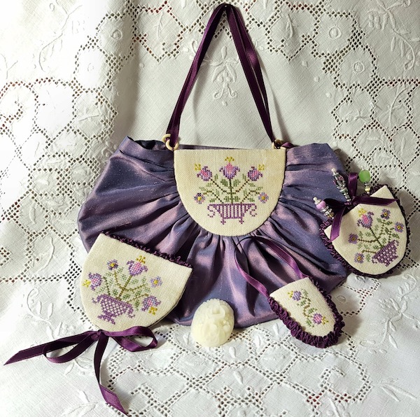 purple sewing purse with flower pots and lilies and lavanders embroidered by Giulia Punti Antichi