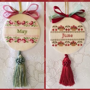 two christmas ornaments embroidered with bow and tassle for months of May and June